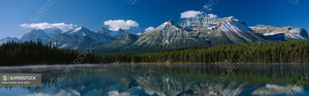 herbert lake & mountains capped with first snow of autumn morning banff national park, alberta, south western canada