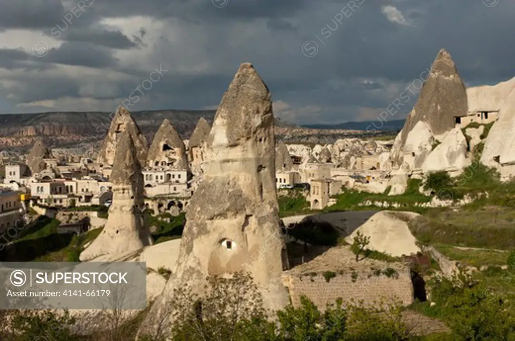 Tower-like tuff rock cones or fairy chimneys with cut-out living space or storage facilities, Goreme, Cappadocia, Turkey