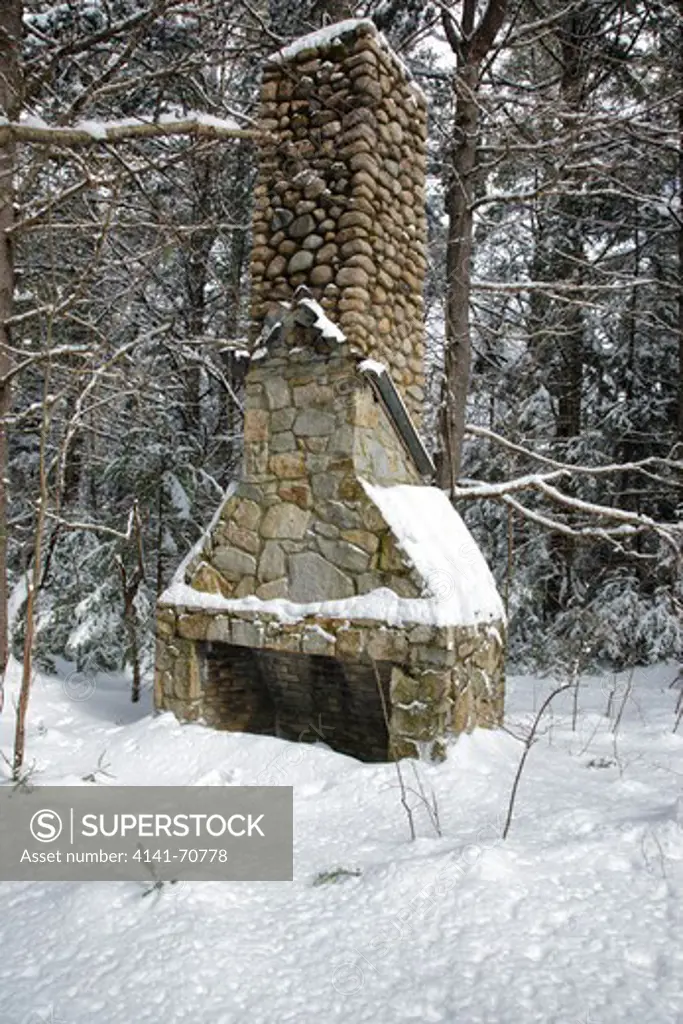 Old stone fireplace in the area of the abandoned Passaconaway Settlement in Albany, New Hampshire USA. This area was part of the Swift River Railroad era, which was an logging railroad in operation from 1906 - 1916