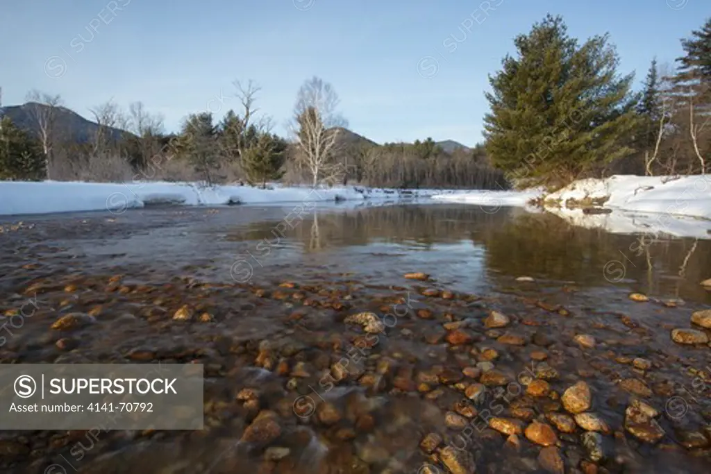 Swift River during the winter months in Albany, New Hampshire USA. This river travels along side of the Kancamagus Scenic Byway, which is one of New England's scenic byways