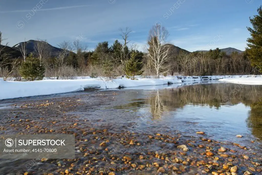Swift River during the winter months in Albany, New Hampshire USA. This river travels along side of the Kancamagus Scenic Byway, which is one of New England's scenic byways