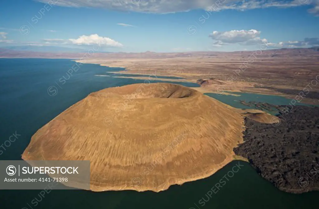Lake Turkana is situatated in the Great Rift Valley in Kenya.  It is the worldÕs largest desert lake and the worldÕs largest alkaline lake. Rocks in the surrounding area are predominantly volcanic.