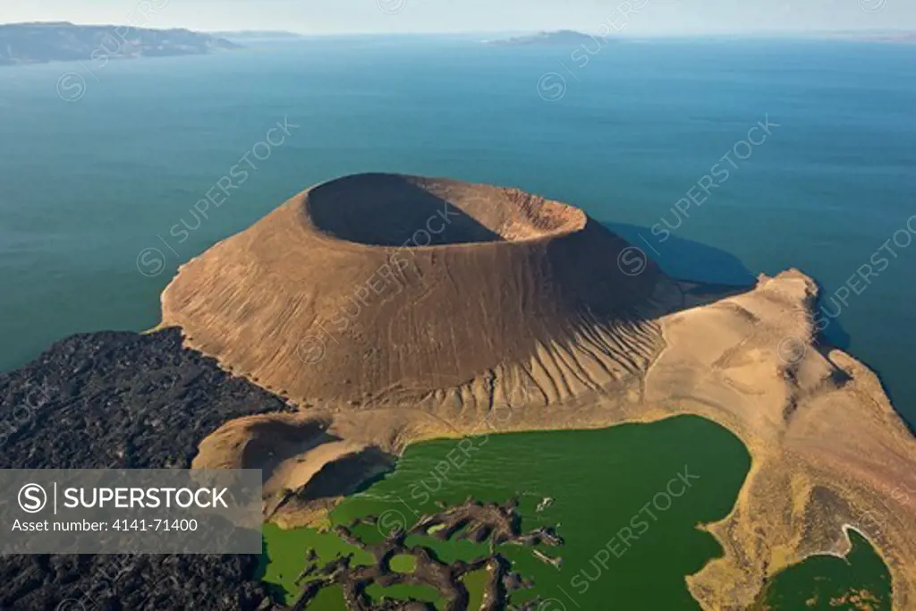 Lake Turkana is situatated in the Great Rift Valley in Kenya.  It is the worldÕs largest desert lake and the worldÕs largest alkaline lake. Rocks in the surrounding area are predominantly volcanic.