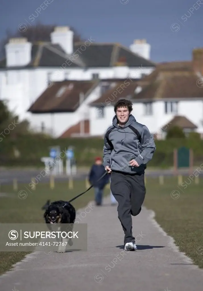 Recreation Adult male dog running with owner Gosport, UK