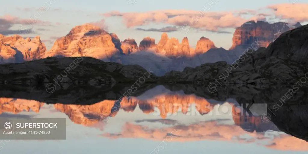 Reflected paeks at sunset on Lake Nero, Adamello-Brenta Natural Park, Trentino, Italy
