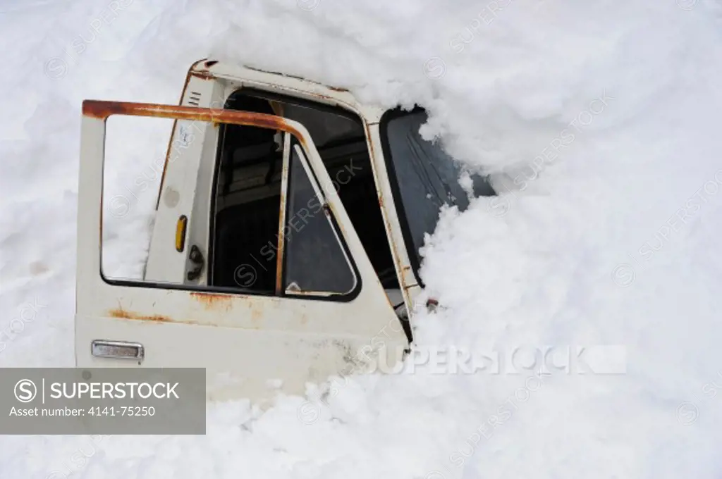 Old truck buried in snow; Japan.