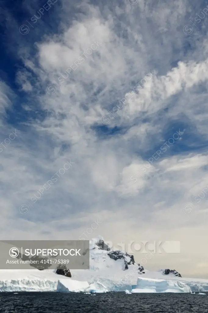 High clouds; near Cuverville Island, Antarctic Peninsula, Antarctica.