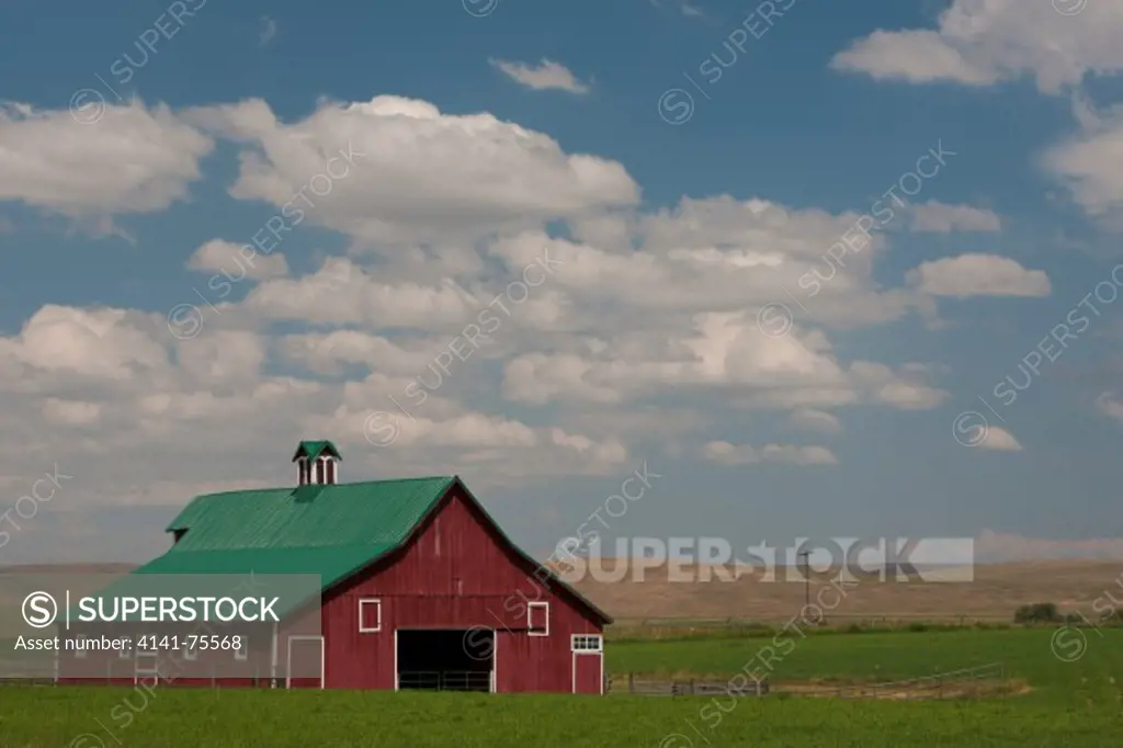 Barn near Joseph, Oregon, with summer clouds.