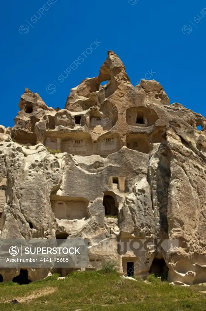 Hollowed fortress-like tuff rocks with storage rooms at the UNESCO World Heritage site Garamba National Park and the Rock Sites of Cappadocia, Cavusin, Cappadocia, Turkey