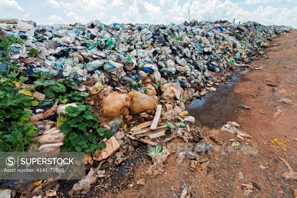 Garbage being prepared for compacting trash in sanitary landfill of the city of Goiania, Brazil