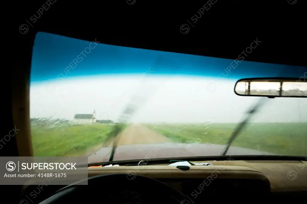 An abstract of a truck driving in rain