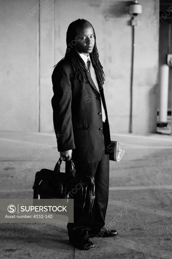 Businessman standing with a bag