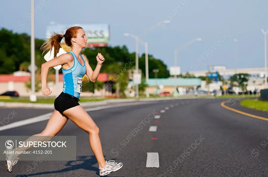 Female Athlete participating in a marathon race