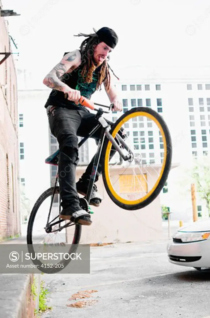 Man performing stunts on a bicycle