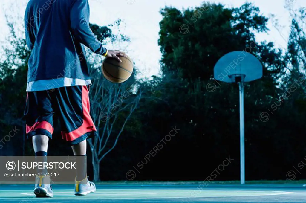 Basketball player practicing in a court