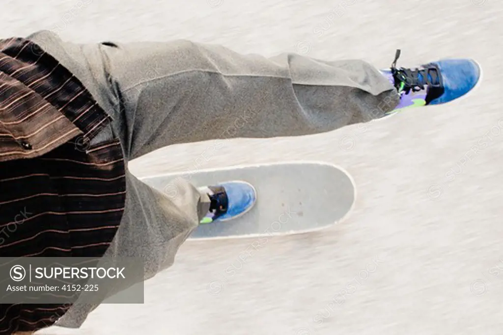 Low section view of a man skateboarding