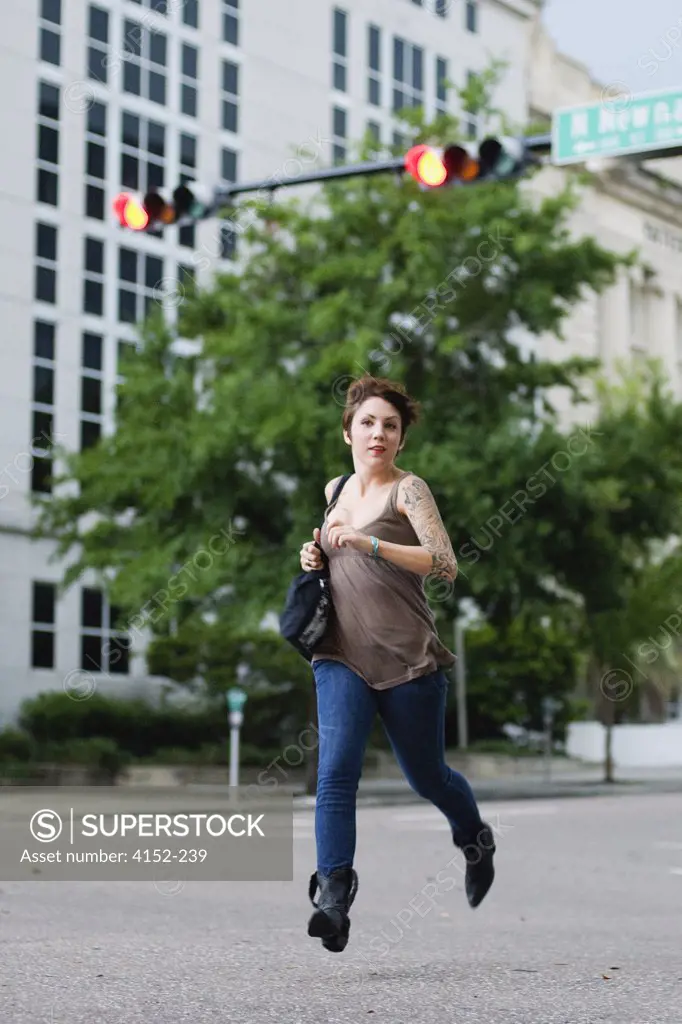 Woman running on a road