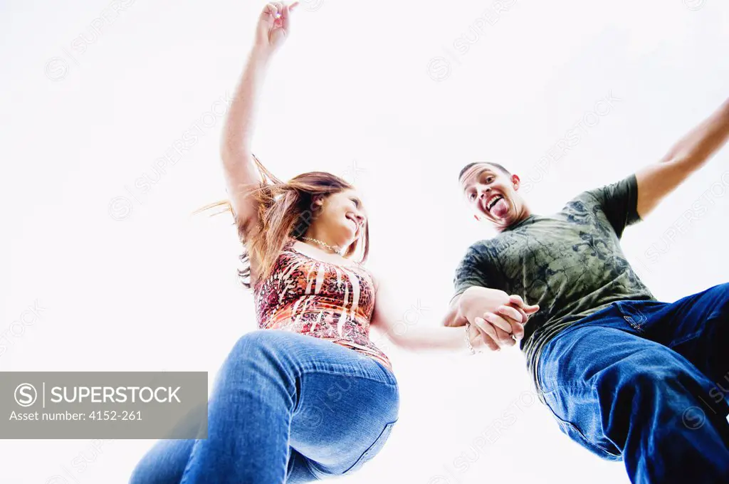 Low angle view of a young couple dancing