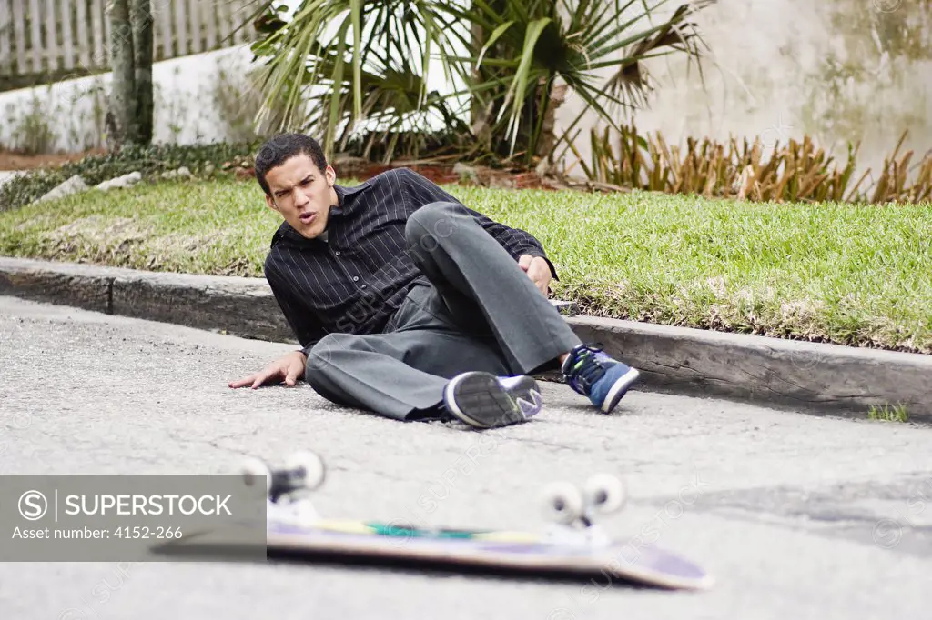 Skateboarder falling