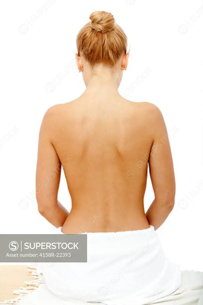Beautiful woman's back relaxing at a spa