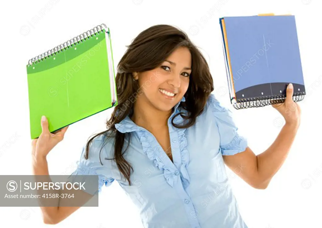 Beautiful girl holding notebooks - isolated over a white background