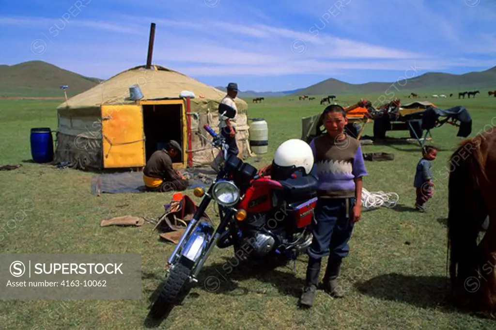 MONGOLIA, NEAR ULAN BATOR, GRASSLAND, MOTOR BIKE IN FRONT OF GER (YURT)