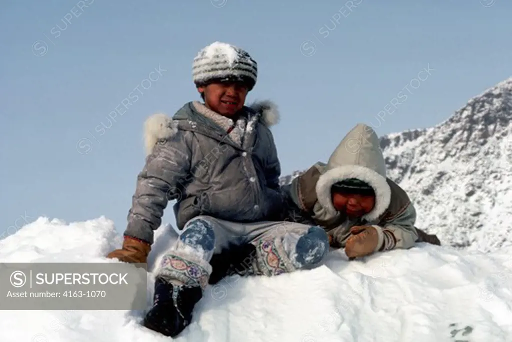 CANADA, ELLESMERE ISLAND, GRISE FJORD, ESKIMO CHILDREN PLAYING IN SNOW
