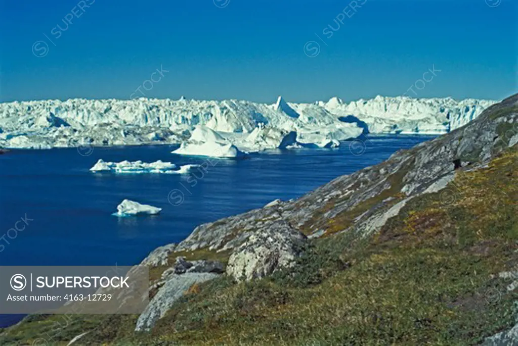 GREENLAND, ICEBERGS BREAK OF THE GLACIER AT DISCOBAY, JAKOBSHAVN AND DRIFT OUT AT SEA