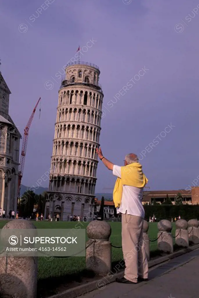 ITALY, PISA, MAN ""HOLDING UP"" THE LEANING TOWER OF PISA
