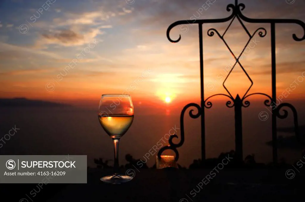 ALBANIA, SARANDA, WINE GLASS IN SUNSET