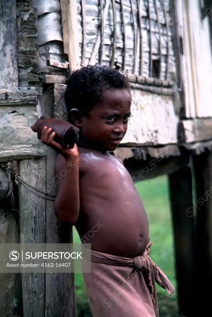 PAPUA NEW GUINEA,TROBRIAND ISLANDS, KIRIWINA ISL., KAIBOLA VILLAGE PORTRAIT OF BOY