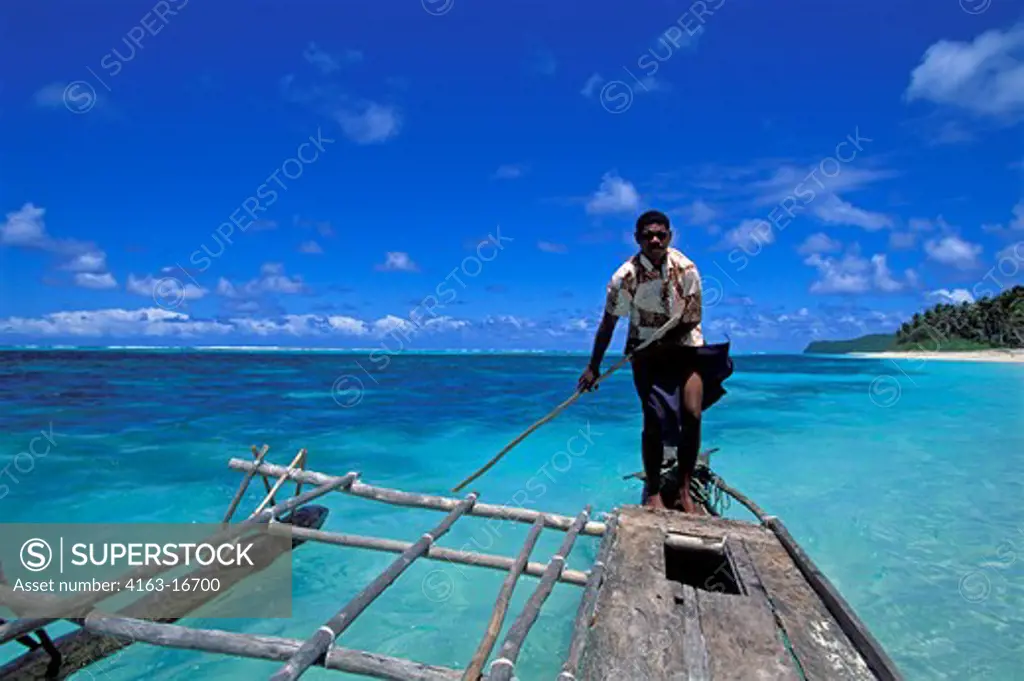 FIJI, LAU GROUP, FULANGA ISLAND, BEACH, MAN IN OUTRIGGER CANOE