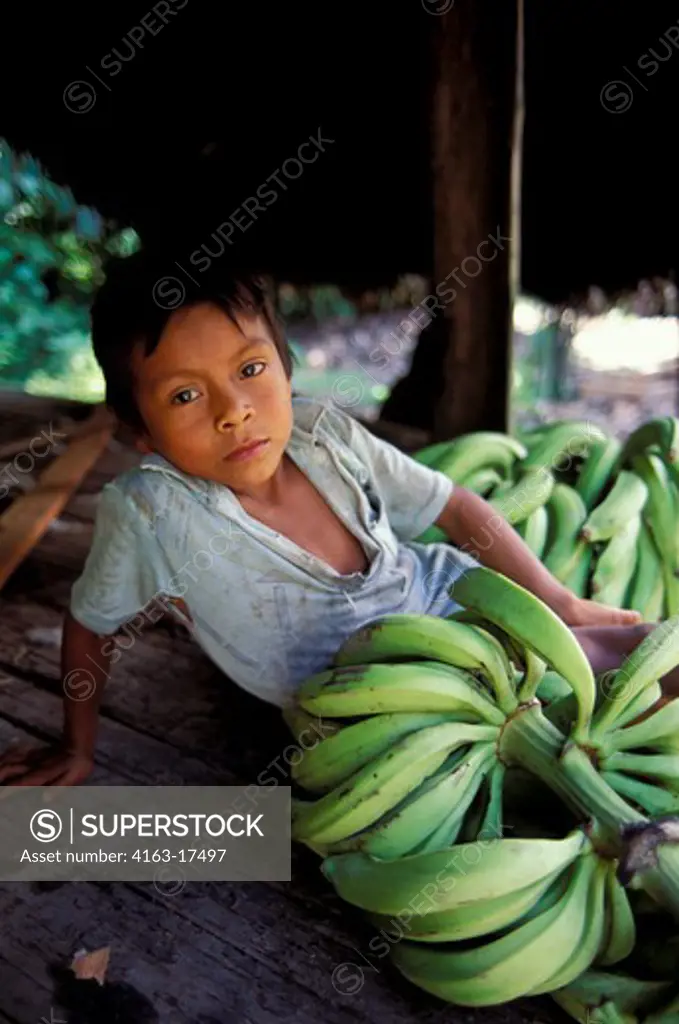 ECUADOR, AMAZON BASIN, NEAR COCA, RAIN FOREST, INDIAN BOY WITH BANANAS