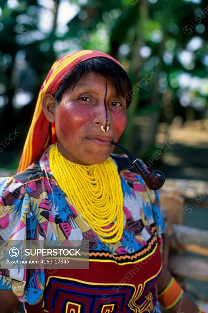 PANAMA, SAN BLAS ISLANDS, ACUATUPU ISLAND, KUNA INDIAN WOMAN WITH PIPE, CLOSE-UP