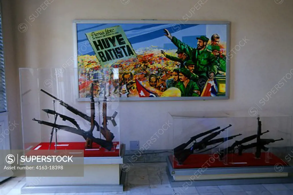 CUBA, OLD HAVANA, MUSEUM OF THE REVOLUTION, INTERIOR, WEAPONS AND BILLBOARD