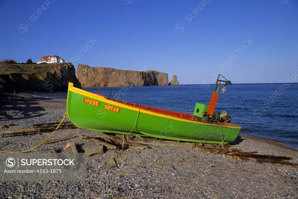CANADA, QUEBEC, GASPE, PERCE, FISHING BOAT ON BEACH WITH PERCE ROCK IN BACKGROUND