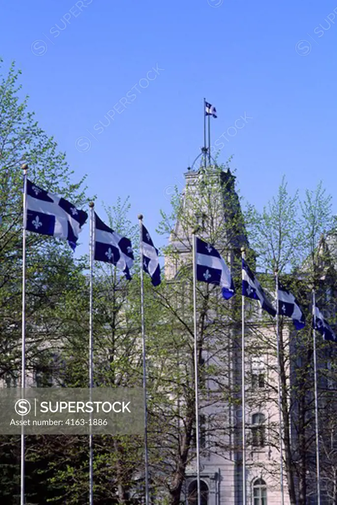 CANADA,QUEBEC,QUEBEC CITY, QUEBEC PROVINCIAL FLAGS IN FRONT OF PARLIAMENT
