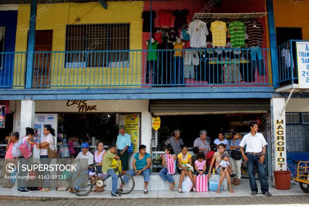 COSTA RICA, TOWN OF UPALA, STREET SCENE, BUS STATION, PEOPLE WAITING FOR BUSSES