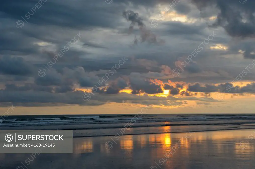 COSTA RICA, NEAR JACO, BEACH, SUNSET WITH CLOUDS