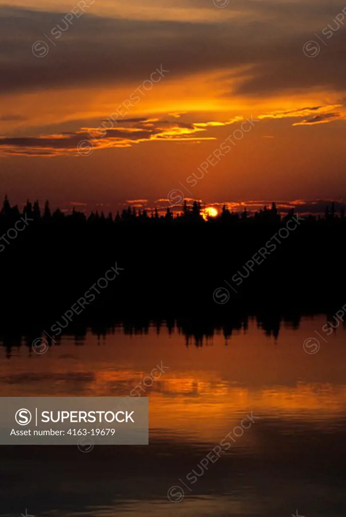 RUSSIA, SIBERIA, YENISEY RIVER, NEAR LEBED, SUNSET OVER TAIGA FOREST