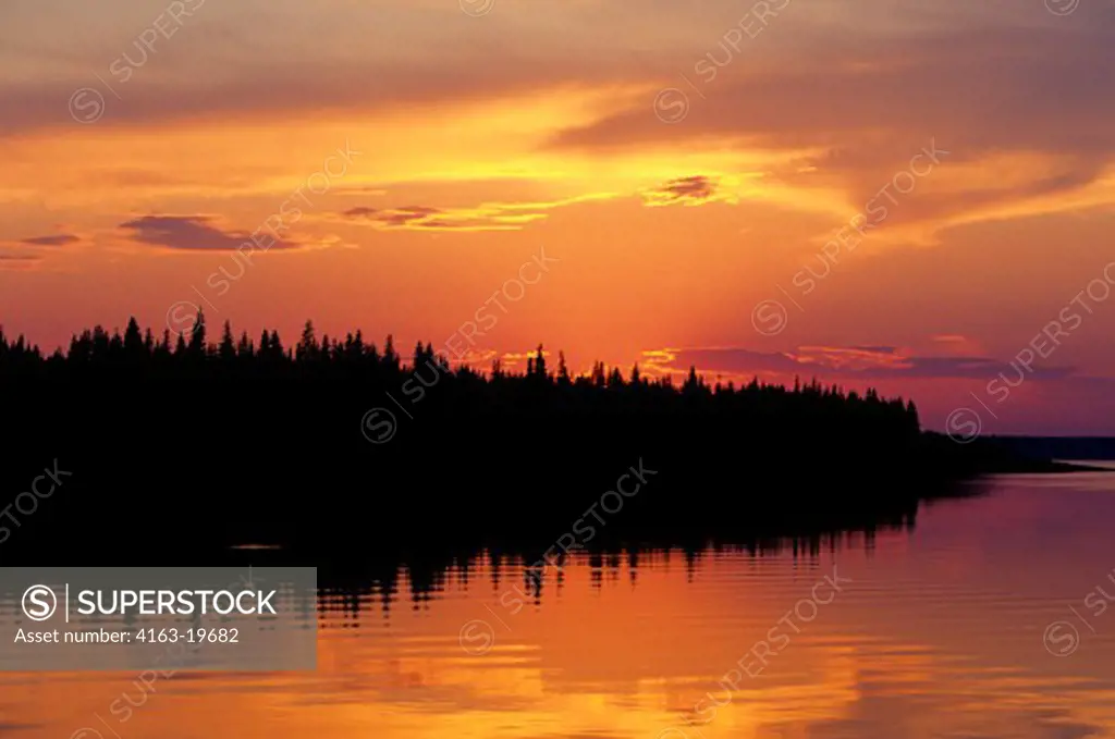 RUSSIA, SIBERIA, YENISEY RIVER, NEAR LEBED, SUNSET OVER TAIGA FOREST