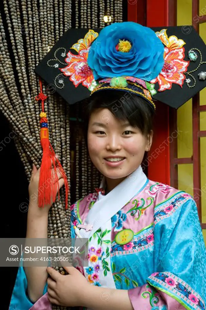 China, Beijing, Baijia Dayuan Restaurant, Portrait Of Waitress Dressed In Traditional Costume