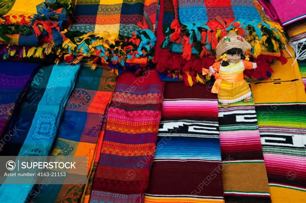 Mexico, Yucatan Peninsula, Near Cancun, Maya Ruins Of Chichen Itza, Souvenir Stand With Colorful Woven Fabrics