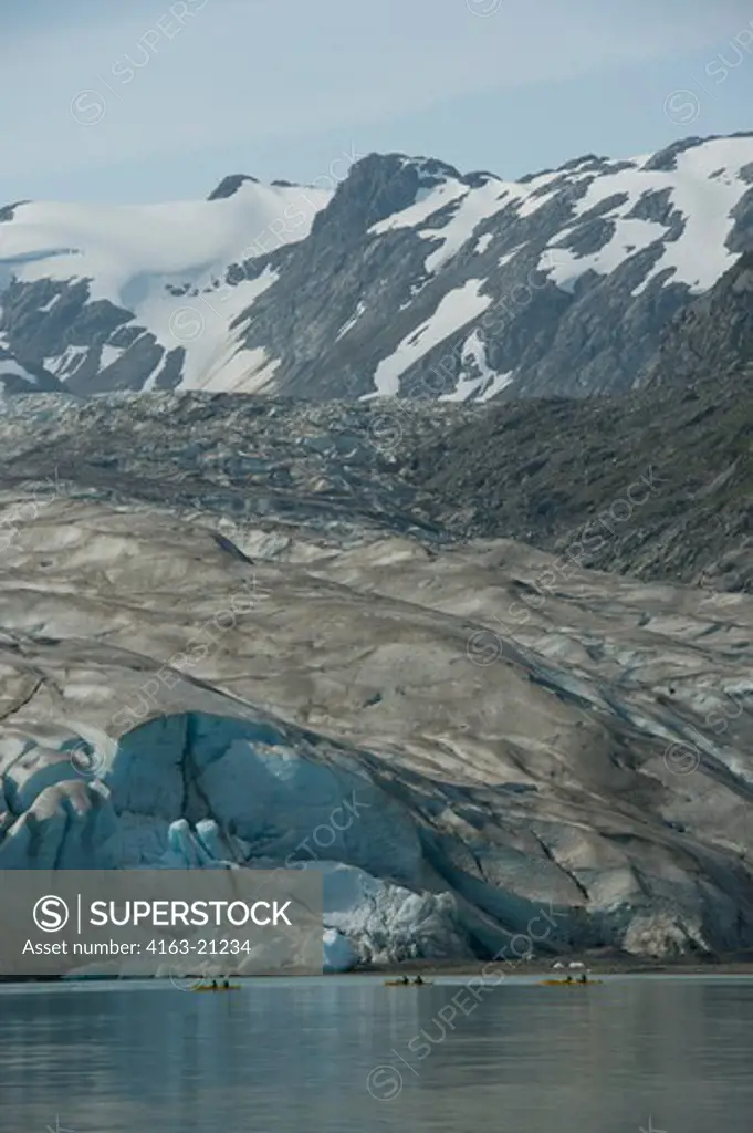 People kayaking in front of Reid Glacier in Glacier Bay National Park, Alaska, USA