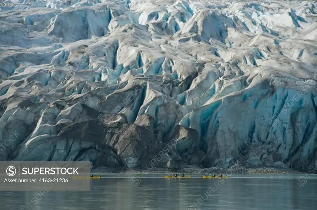 People kayaking in front of Reid Glacier in Glacier Bay National Park, Alaska, USA