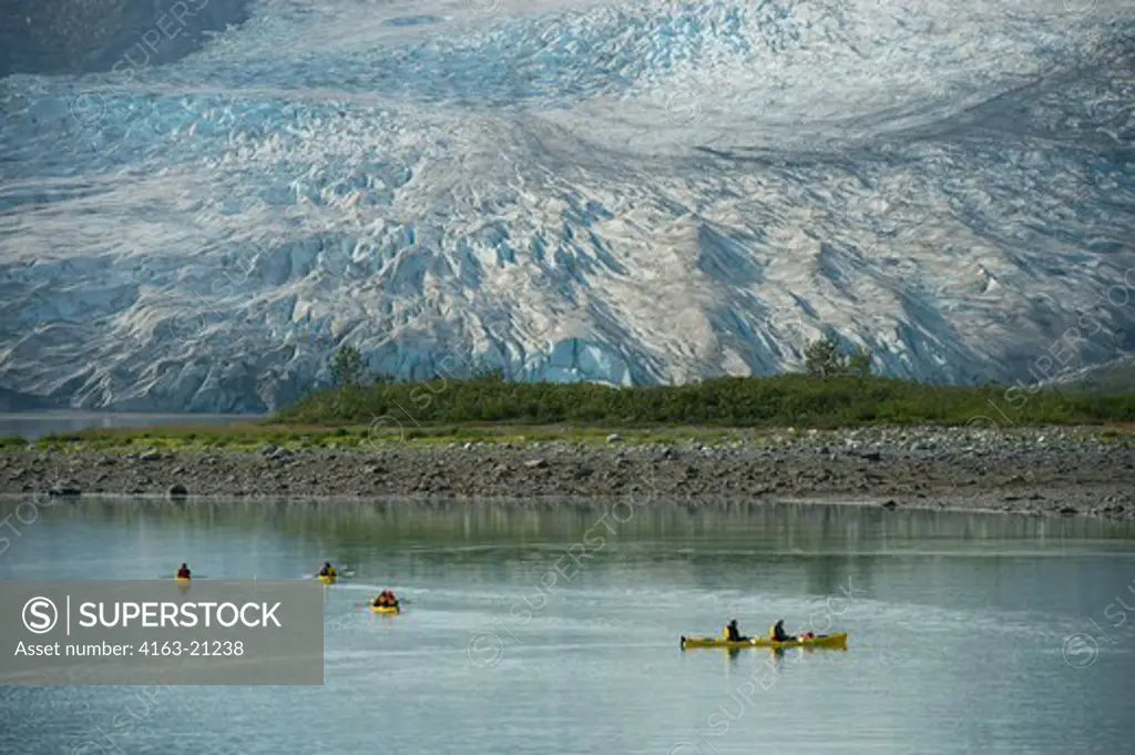 People kayaking with Reid Glacier in background, Glacier Bay National Park, Alaska, USA