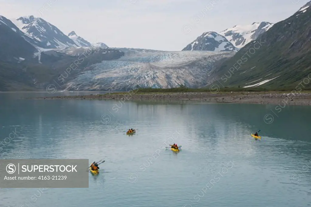 People kayaking with Reid Glacier in background, Glacier Bay National Park, Alaska, USA