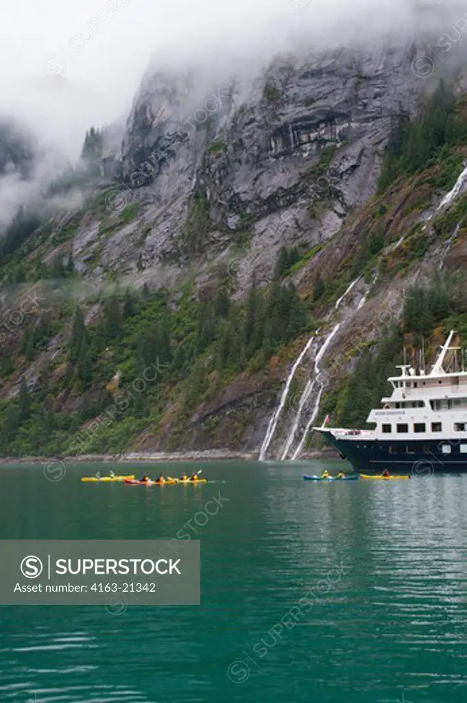 Passengers of cruise ship Safari Endeavour sea kayaking at Fords Terror, Endicott Arm, Tongass National Forest, Alaska, USA