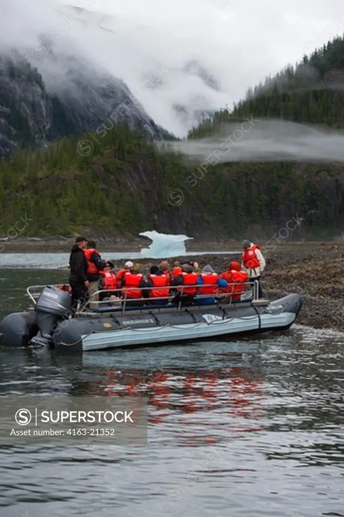People in DIP boat exploring small iceberg at Fords Terror, Endicott Arm, Tongass National Forest, Alaska, USA