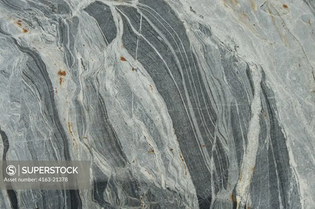 Beautiful striations and patterns in rocks of fjord wall near Dawes Glacier, Endicott Arm, Tongass National Forest, Alaska, USA